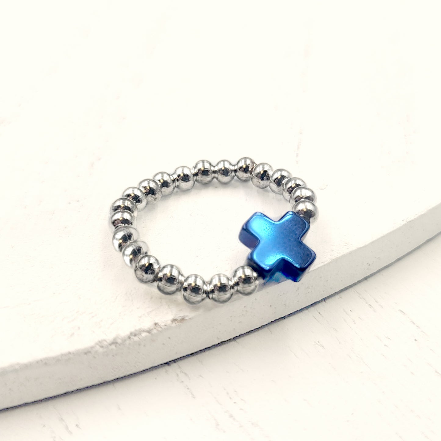 Electroplate Hematite Cross Beaded Stretch Rings. Blue
